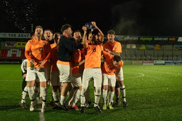 Edgehill open up the champagne to celebrate their League Trophy final win.