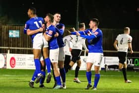Whitby Town players celebrate their leveller at home to Marine.