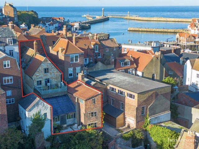 A rear view of the property with its first floor terrace.