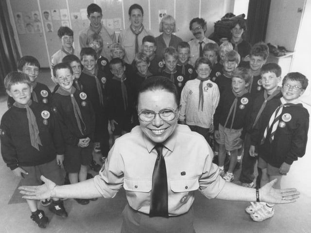Scout leader Margaret Temlett, centre, was retiring from Hunmanby First Scout Group after 18 years' service in July 1997. She is pictured with her group. 