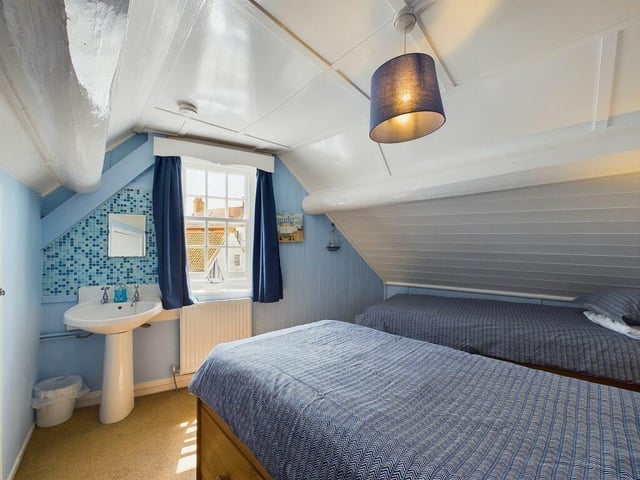 A tgwin-bedded room on the upper floor.
