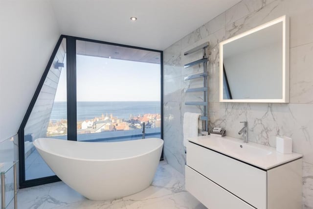 One aspect of one of five luxury bathrooms - soak up a sea view while bathing.