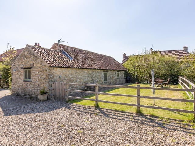 One of the lawned areas with the property in Thornton le Dale