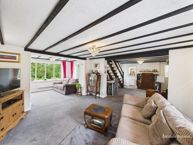 The beamed, open plan interior.