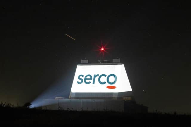 The Serco logo is lit up at RAF Fylingdales on the Solid State Phased Array Radar's 30th anniversary.