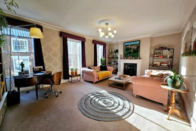 A stunning versatile room with feature fireplace.