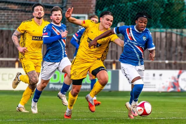 Donald Chimalilo races away from the Leek Town defence. Photo by Brian Murfield
