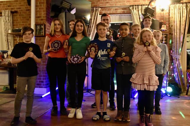 Bridlington Road Runners junior stars show off their trophies at the club's annual presentation night. PHOTOS BY TCF PHOTOGRAPHY
