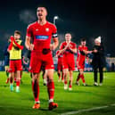 Boro skipper and goal-scoring hero Will Thornton, centre, leads the celebrations and thanks to the away fans at Curzon Ashton. PHOTO BY CHRIS MARSON