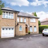 The front of the property has a large driveway.