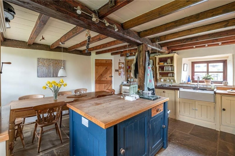 The beamed, traditional style farmhouse kitchen.