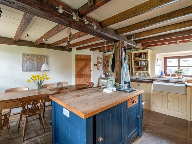 The beamed, traditional style farmhouse kitchen.