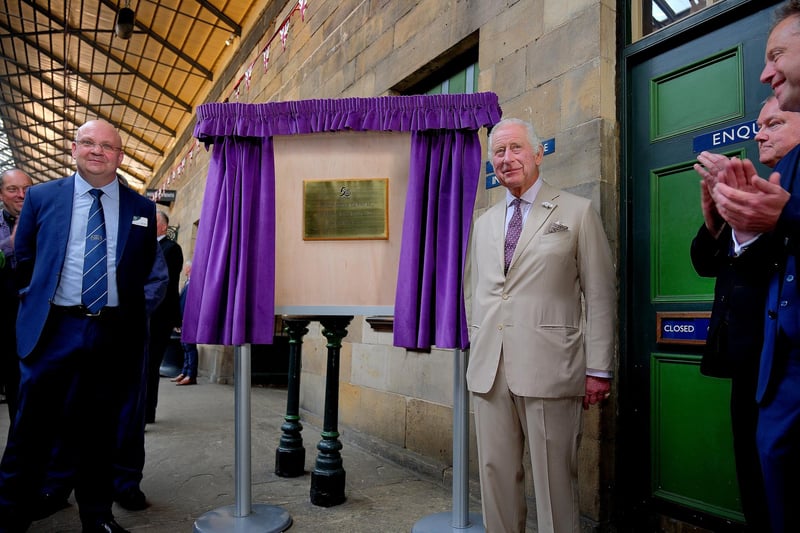 King Charles unveils the plaque commemorating the visit