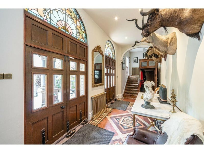 The tiled floor and architecture make even a hallway an outstanding feature.