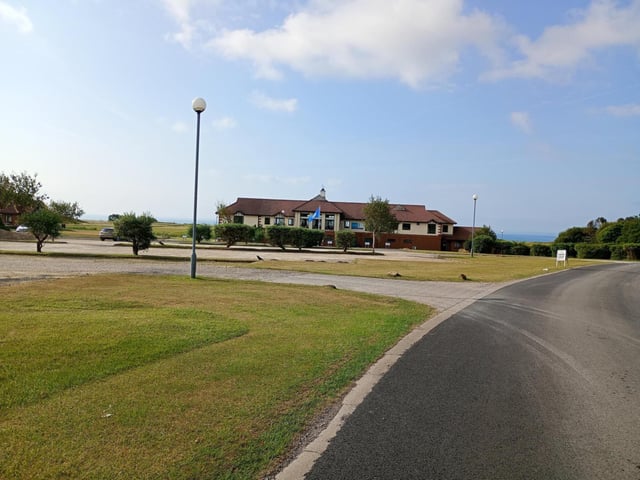 Shelagh E Wallace frames Bridlington Links clubhouse.