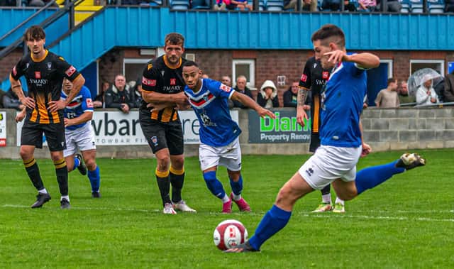 Jacob Graton scores the winner for Whitby Town from the penalty spot in the FA Cup clash against Morpeth Town. PHOTOS BY BRIAN MURFIELD