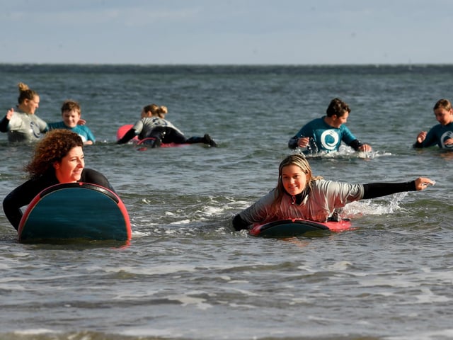 All smiles as people take a dip in the sea.