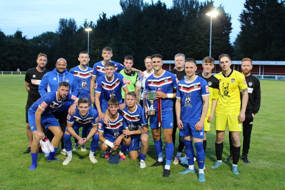 Whitby Town celebrate their Mickey Skinner Memorial Trophy win at Guisborough on Tuesday evening.