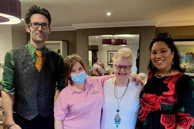 Entertainer Thomas, team member Jessica, resident Suzie Sherwin and entertainer Sasha come together for a photo after the Christmas Party.