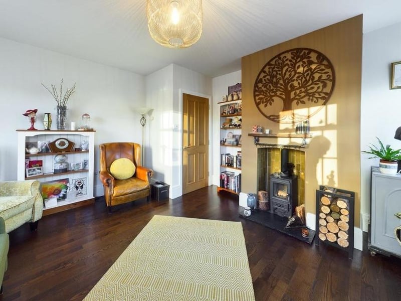 There's a lounge within the apartment with a cosy log burning stove, and three double glazed sash windows,