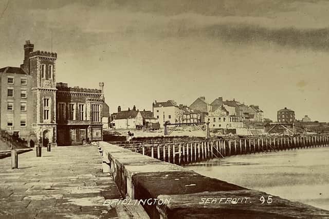 This rare sepia postcard shows the building of the sea wall and Parade.