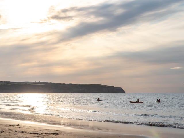 Kayakers out on the sea at Whitby, by Deborah McCarthy.