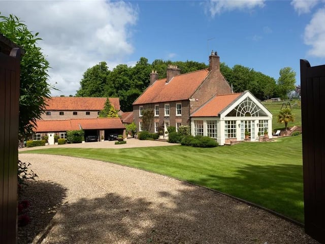 This six bedroom, four bathroom and six reception room detached house is currently for sale with Savills for offers over £1,795,000.