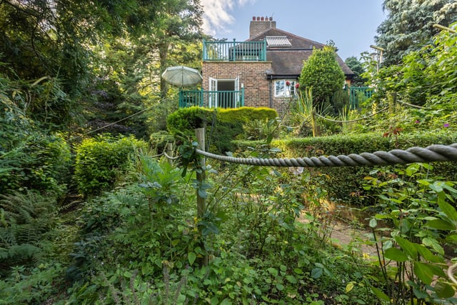 The lush garden surrounds the property.