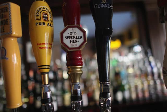 Here's which pubs and bars will be open and closed on Bank Holiday Monday. (Photo by Mario Tama/Getty Images)
