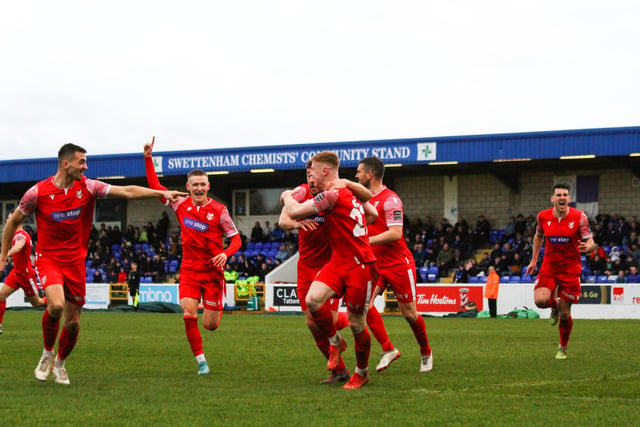 The Scarborough players get in the party mood after their injury-time equaliser at Chester.