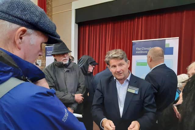 Europa Oil & Gas CEO William Holland speaks with residents