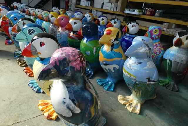 The puffin sculptures all lined up at West Building Supplies, waiting for a final spruce up before the big display.