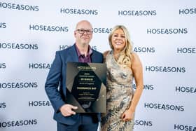 Vaughn Medhurst (Bourne Leisure) collects the award from Gemma Brown (general manager of Hoseasons)