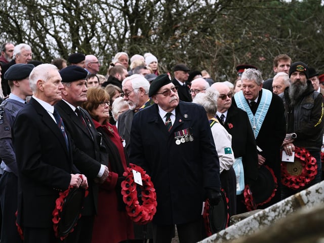 Reflecting before laying the wreathes