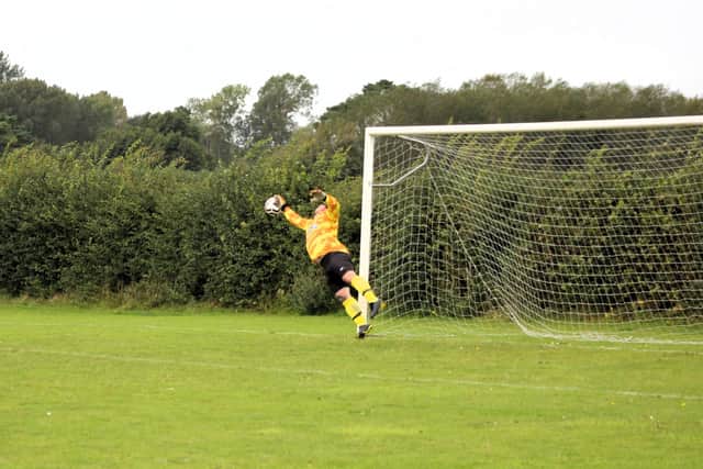 Manager Johnny McGough makes an outstanding save from a Joseph Nock strike