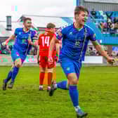 Defender Harrison Beeden, above, centre, has signed a new contract with Whitby Town for 2023-24 season
