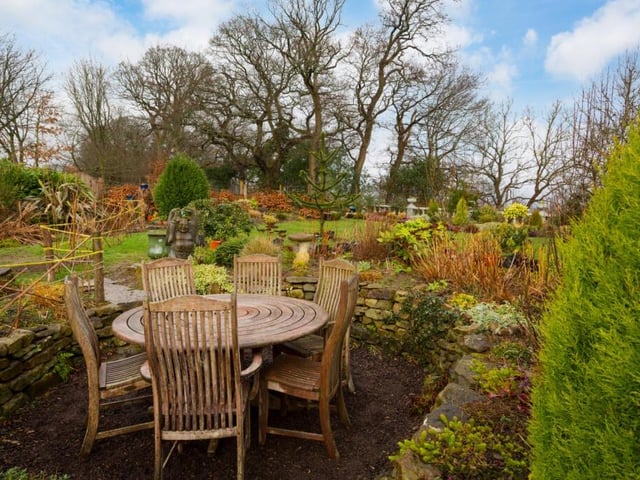 A dedicated seating area in the landscaped garden.