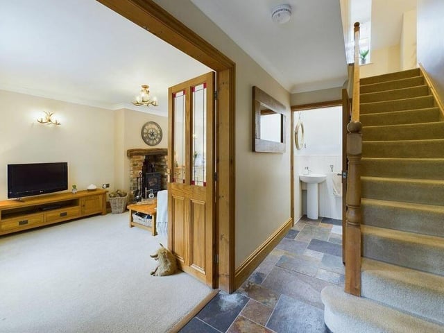 The entrance hall to the cottage, with staircase leading up.