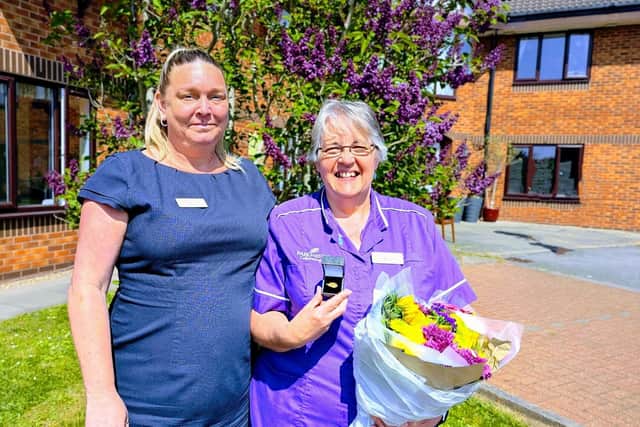 Wendy (right) celebrating her long service award