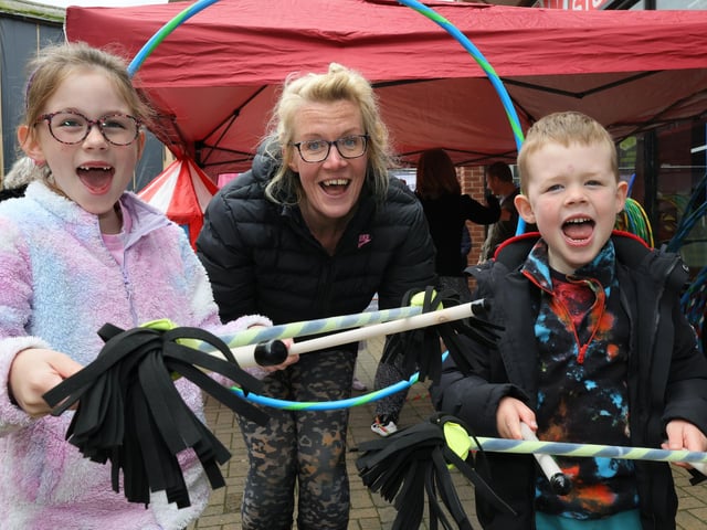 Kate has fun juggling with her children
