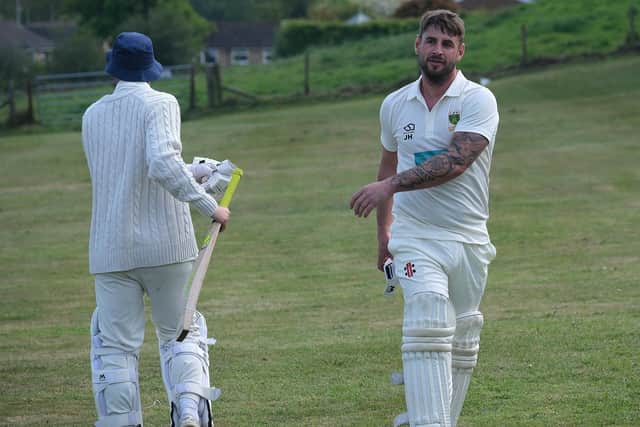 Cloughton batsman Jack Hakings walks back to the changing rooms after being dismissed four runs short of a century against Scarborough Hospital. Photo by Richard Ponter