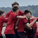 Phoenix Under-15s celebrate the winner in their 3-2 success at home to rivals Wigginton.