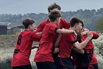 Phoenix Under-15s celebrate the winner in their 3-2 success at home to rivals Wigginton.