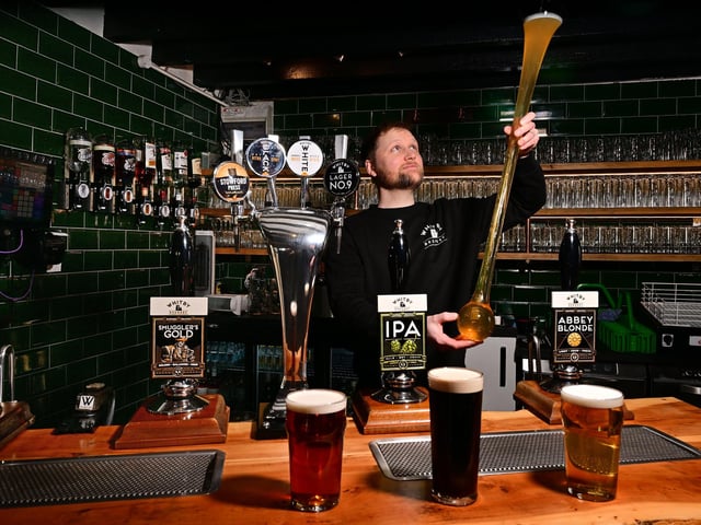 Richard Wells with the ultimate student drinking challenge - the yard of ale!