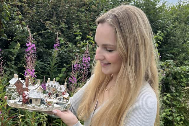 Valuer Charlotte Trueman with a model which fetched £340 + buyer’s premium.