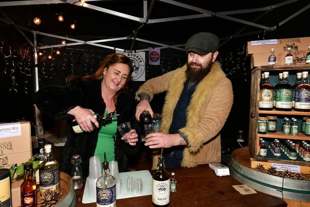 Janine Robinson and Piers Moat preparing a festive tipple