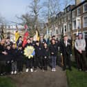 Pupils from Friarage School join the service with their wreath
