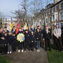 Pupils from Friarage School join the service with their wreath