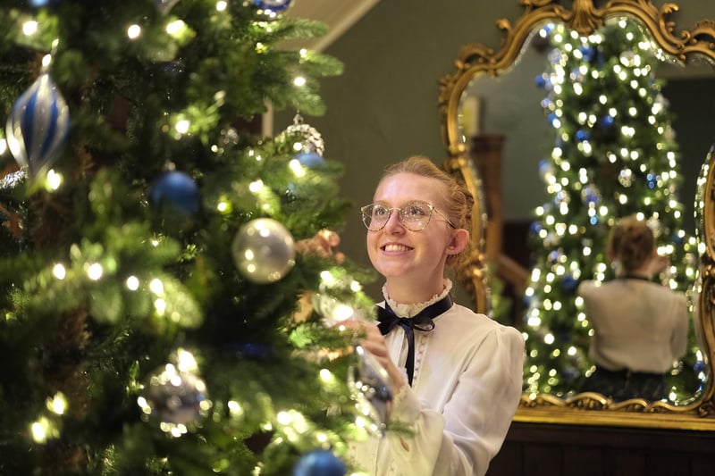 Hotel Victoria staff member Danni Nicks decorates the tree. picture: Richard Ponter