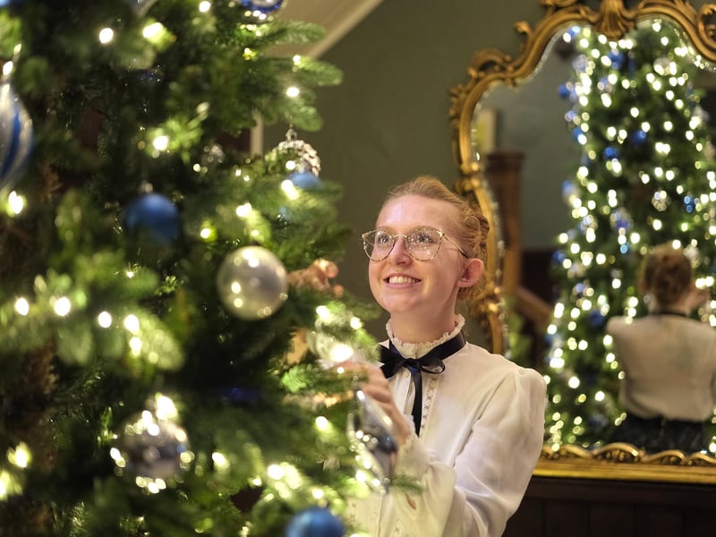 Hotel Victoria staff member Danni Nicks decorates the tree. picture: Richard Ponter
